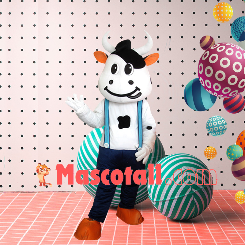 Lively Cartoon Cow In Suspenders Mascot Costume